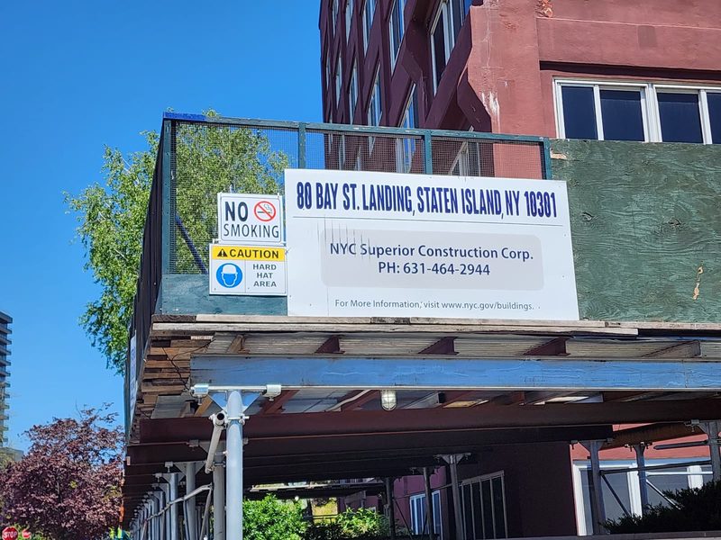 Department of Buildings project sign on the sidewalk shed reading 80 Bay St. Landing, Staten Island, NY 10301, NYC Superior Construction Corp